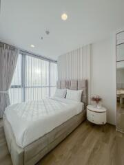 modern bedroom with large windows and natural light