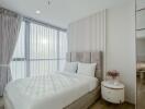 modern bedroom with large windows and natural light