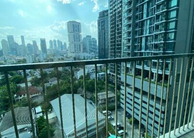 View from the balcony of a high-rise apartment with city skyline