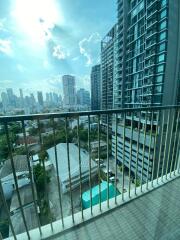 View from the balcony of a high-rise apartment with city skyline