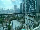 View from the balcony of a high-rise apartment with city skyline