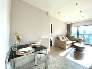 Bright and modern main living space with dining area and seating