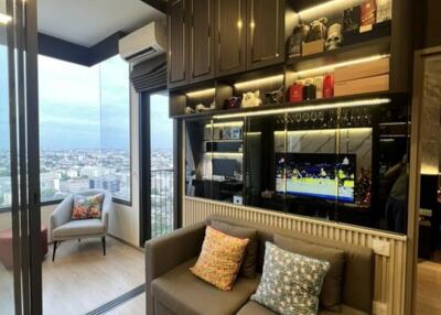 Modern living room with large windows and a city view