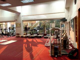 Spacious gym with modern exercise equipment