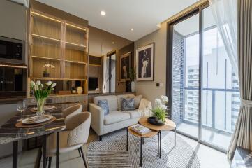 Modern living room with dining area and balcony access