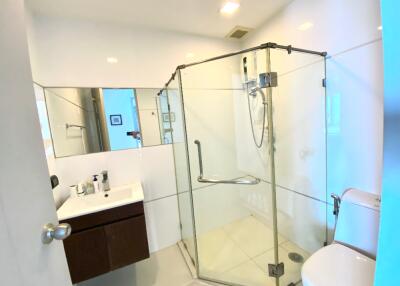 Modern bathroom with corner glass shower