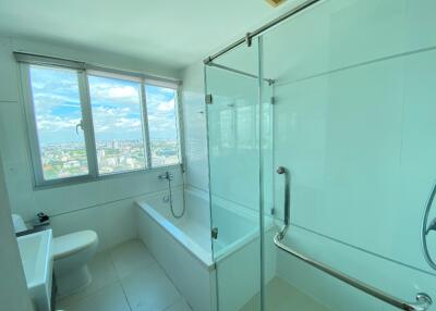 Modern bathroom with large window and city view