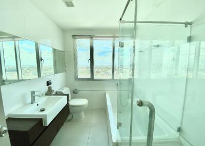 Modern bathroom with large window and city view