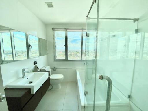 Modern bathroom with large window and city view