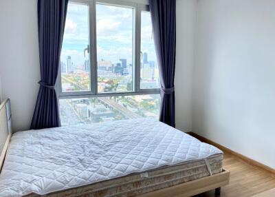 Bedroom with bed and city view