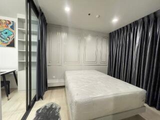 Modern bedroom with large bed and ample storage