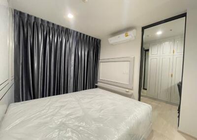 Bright and spacious bedroom with large bed and ample closet space