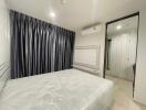 Bright and spacious bedroom with large bed and ample closet space