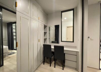 Spacious bedroom with built-in wardrobe and work desk