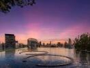 Beautiful sunset view over an outdoor city rooftop pool