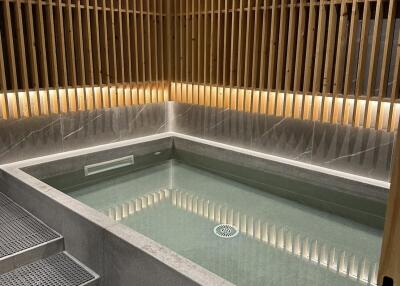 Modern bathroom with soaking tub and wooden wall paneling