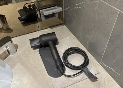 Bathroom countertop with hairdryer and mirror