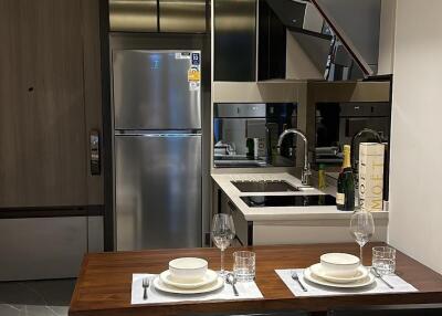 Modern kitchen with dining area in a compact space