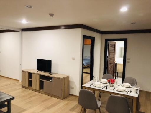 Modern living area with dining table and TV