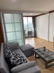 Modern living room with glass sliding door and city view