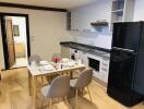 Modern kitchen with dining area and appliances