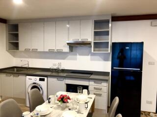 Modern kitchen with appliances and dining area