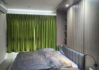 Master bedroom with modern design and natural lighting