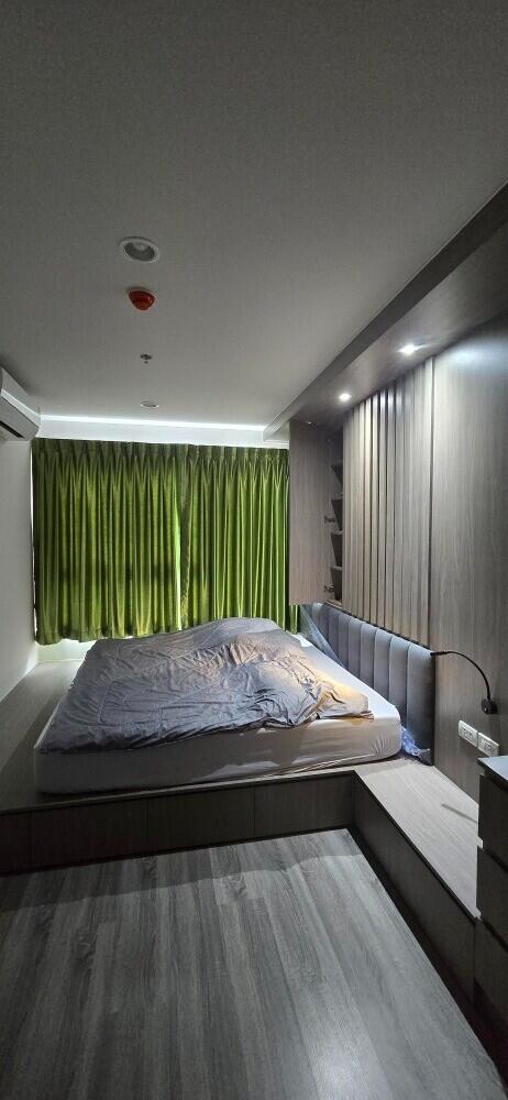 Master bedroom with modern design and natural lighting