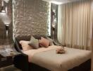 Modern bedroom with textured accent wall and ambient lighting