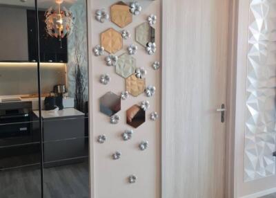 Modern hallway with mirror and artistic wall decorations