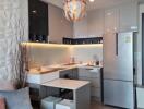 Modern kitchen with metallic finishes and seating