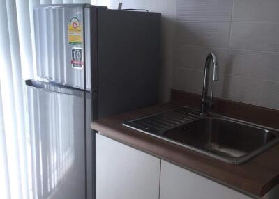 Modern kitchen with refrigerator and sink area