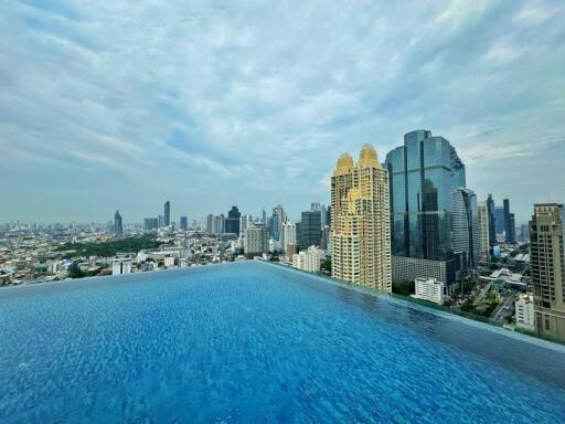 Infinity pool with city skyline view