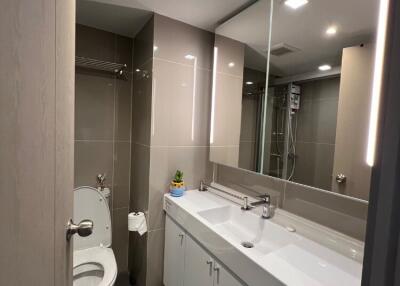 Modern bathroom with large mirror and double sink