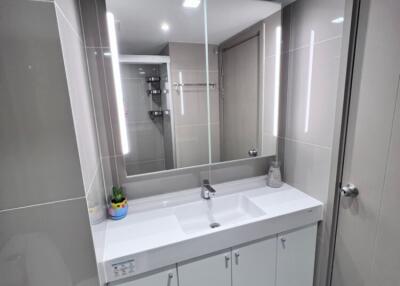 Modern bathroom with large mirror and sink