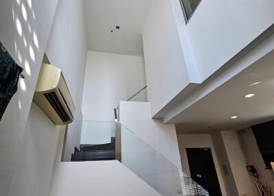 Modern multi-story interior space with staircase