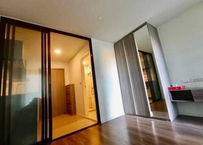 Modern bedroom with ensuite bathroom and mirrored closet