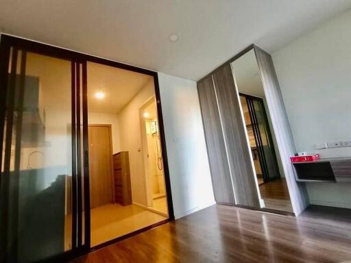 Modern bedroom with ensuite bathroom and mirrored closet