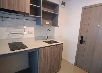 Modern compact kitchen with wooden cabinetry