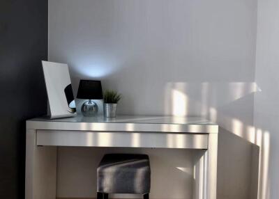 Modern desk area with lamp and decor