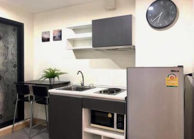 Modern kitchen with appliances and dining area