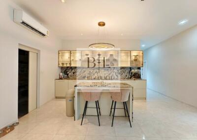 Modern kitchen with island and bar stools