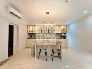 Modern kitchen with island and bar stools