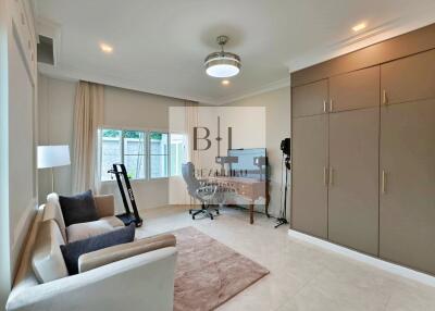 Spacious bedroom with built-in wardrobe and study area