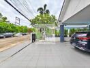 Outdoor area with parking space and greenery