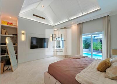 Spacious and modern bedroom with ample natural light