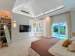 Spacious and modern bedroom with ample natural light