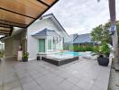 Modern outdoor patio area with seating and pool