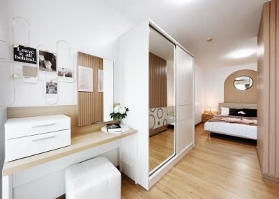 Modern bedroom with built-in closet and wooden flooring