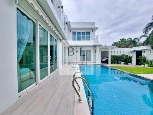 Modern house with a swimming pool and patio area